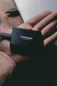 person holding Samsung Portable SSD TS adapter thumbnail