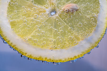 macro photography of sliced lemon in carbonated drink thumbnail