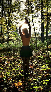 women's black skirt standing inside the forest thumbnail