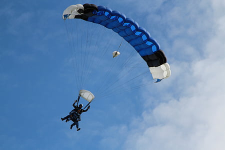 man at blue and white parachute thumbnail