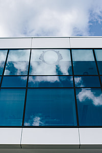 Office building windows and blue sky thumbnail