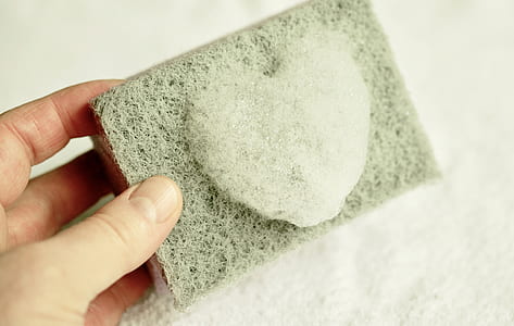 person holding gray heart stone mold thumbnail