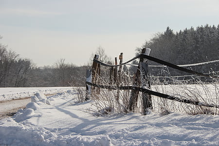 barn fence covered by snow thumbnail
