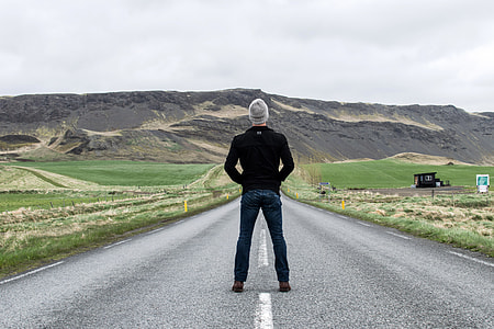 Man standing in the middle of the road in Iceland thumbnail
