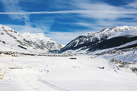 mountain covered with snow under blue sky at daytime thumbnail