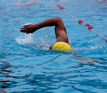 man swimming on pool with yellow cap thumbnail