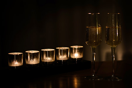 stock photo of two wine glasses and votive candles thumbnail