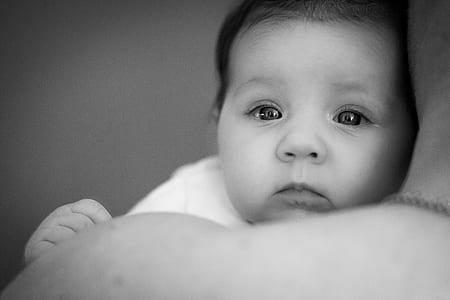 grayscale photo of baby lying thumbnail