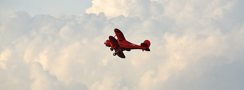 red plane in sky thumbnail