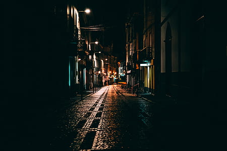 photography of wet concrete road at night thumbnail