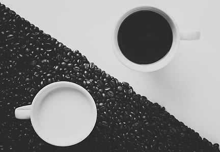 two white ceramic mugs with coffee thumbnail