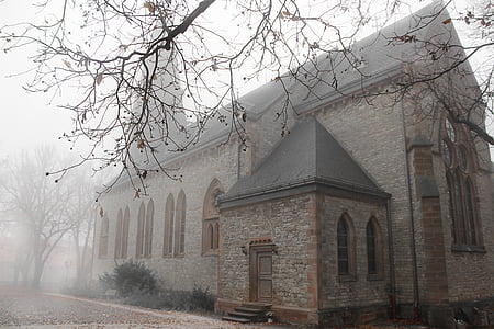 gray concrete house covered with fog during daytime thumbnail
