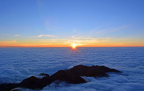 silhouette photo of mountain during noontime thumbnail