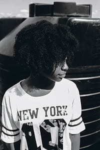 person wearing new-york printed shirt in grayscale photography thumbnail