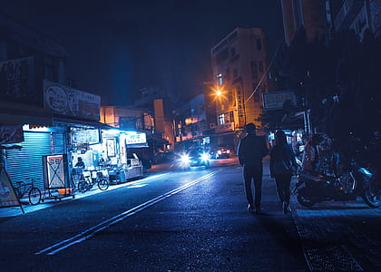 man and woman walking on road thumbnail