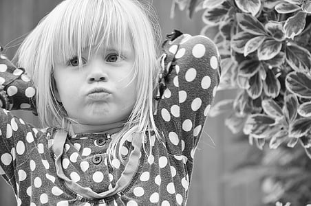 girl wearing black and white polka-dot clothes grayscale photo thumbnail