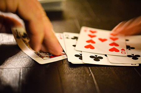 person playing cards thumbnail