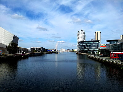 body of water beside building under clear blue sky during daytime thumbnail