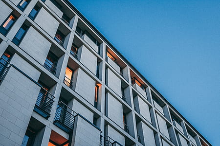 low angle photography of gray high rise building at daytime thumbnail