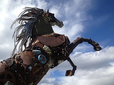 low angle photo of brown metal horse statue thumbnail