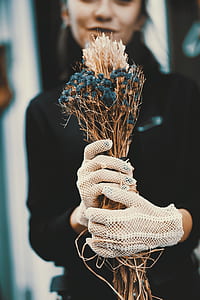 woman holding blue flowers thumbnail