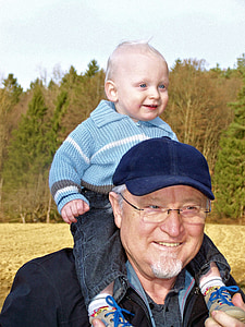 man carrying baby thumbnail