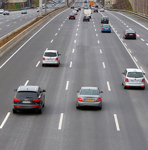 cars in middle of street road thumbnail