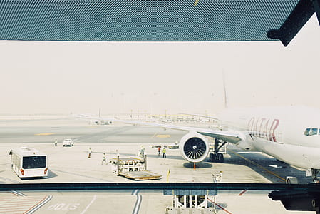 landed white Qatar plane during daytime thumbnail