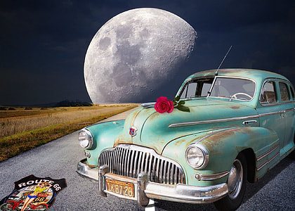 classic green car parked near moon thumbnail