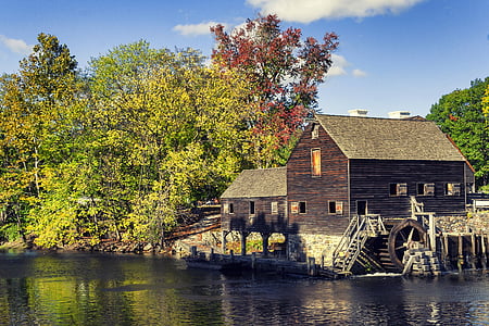 brown house near body of water thumbnail