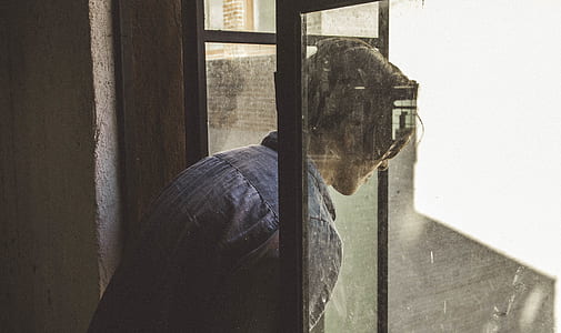 person looking down through glass window thumbnail