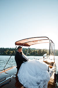Bride and Groom Standing on Yacht thumbnail