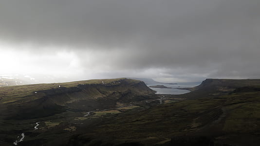 mountain near to body of water thumbnail