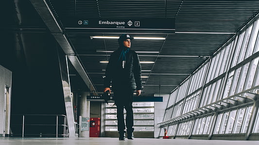 man standing in airport thumbnail