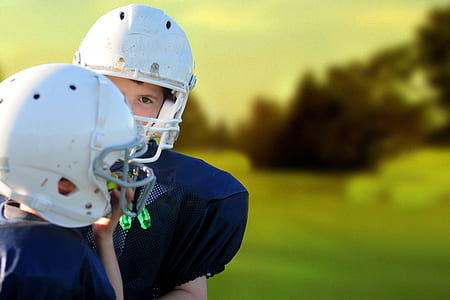 shallow focus photography of two football players wearing white helmet thumbnail