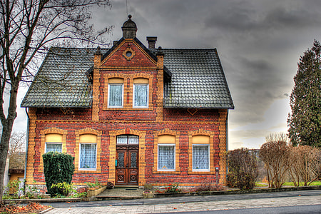 brown stone house near street and trees thumbnail