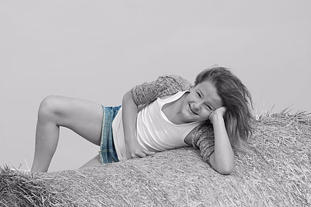 selective color photography of a woman in white tank top, blazer and faded blue denim skirt thumbnail