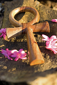 closeup photo of ankh on brown surface thumbnail