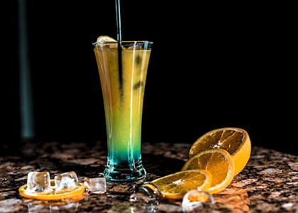 fruit shake filled cup near slices of orange thumbnail