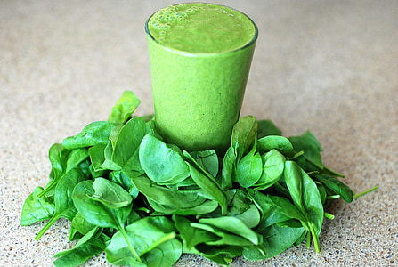 clear glass filled of green liquid substance over green leaves thumbnail
