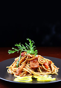 spaghetti topped with green vegetable thumbnail