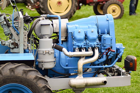 blue and gray machine on grass thumbnail