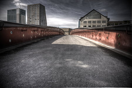 gray concrete bridger under cloudy sky thumbnail