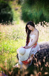 woman wearing white, green, and red floral spaghetti strap dress thumbnail