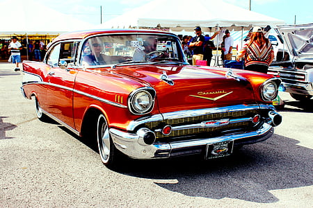 red muscle car during daytime thumbnail