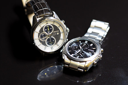 two round black chronograph watches thumbnail