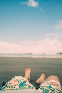 man lying on sand thumbnail