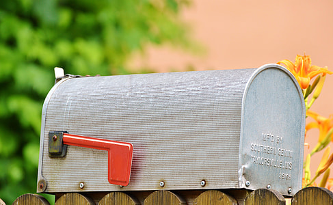 gray and red metal mailbox close-up photo thumbnail