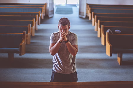 man praying inside the church thumbnail
