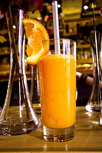 orange juice inside clear drinking glass thumbnail